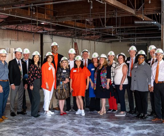 regents wearing hard hats touring the healthcare collaborative buildings